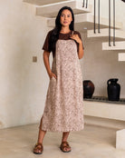 Woman wearing a leopard print dress in an indoor setting