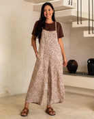 Woman wearing a leopard print dress in an indoor setting