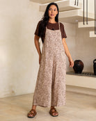 Woman wearing a leopard print dress in a modern indoor setting